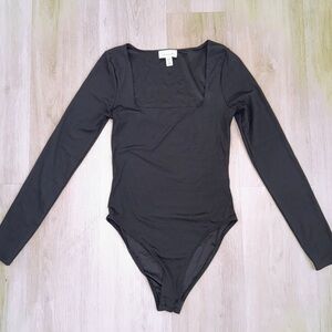 Black Topshop Long Sleeve Body Suit. Women’s size 4
